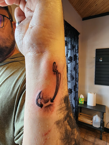 Find introvert tattoo ideas for your next unique tattoo in Minocqua at Walking Arts Tattoos