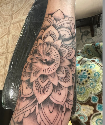 Explore orchid tattoo ideas, creative tattoo ideas in Lemoyne, available at Royalty Tattooing