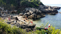 Porto Cofaniello Beach'in fotoğrafı küçük bir koy ile birlikte