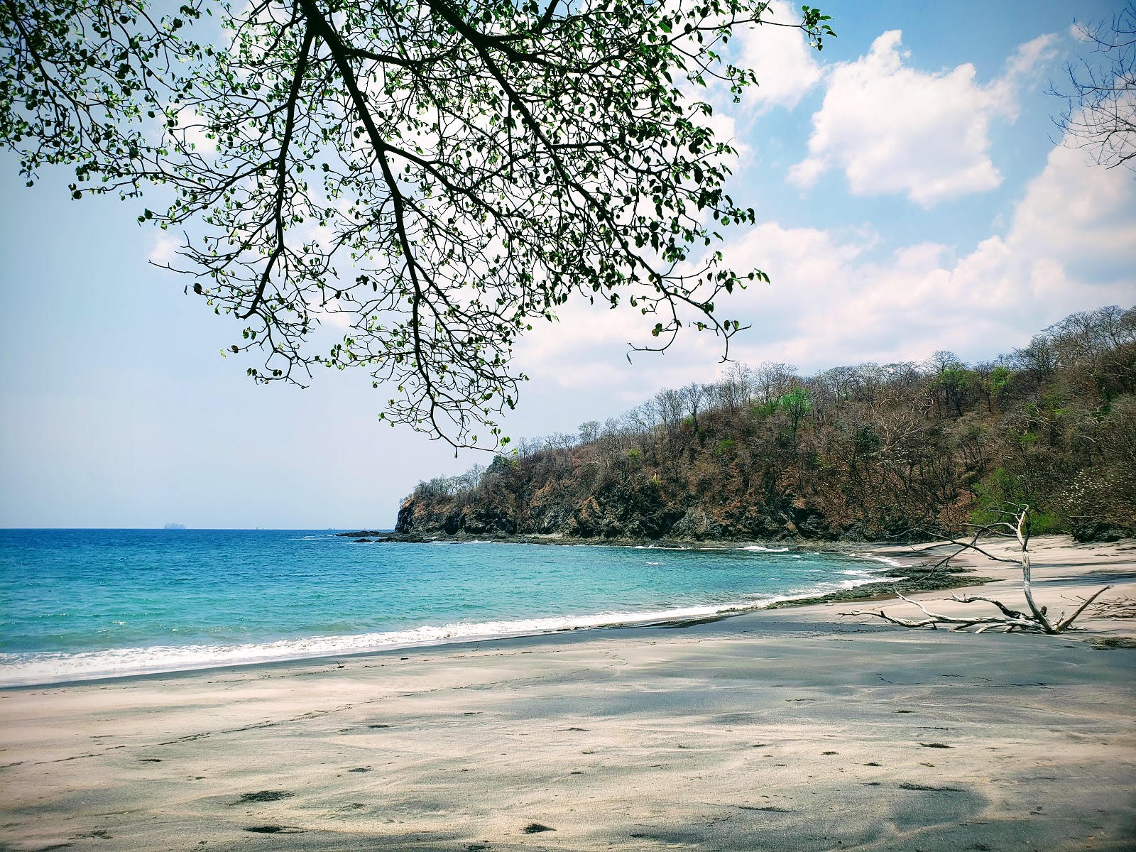 Playa Conejera的照片 带有米色沙子表面