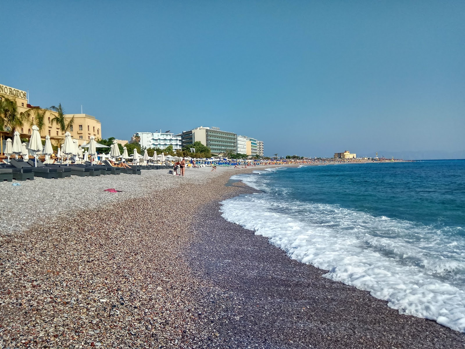 Photo of Elli beach II with black sand & pebble surface