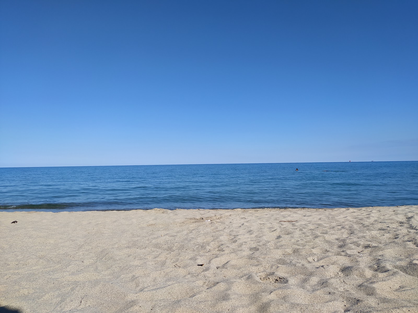 Crotone long beach II'in fotoğrafı parlak ince kum yüzey ile