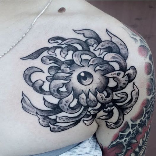 Explore tricep tattoo ideas for men, creative tattoo ideas in Dallas, available at Change of Tides Tattoo