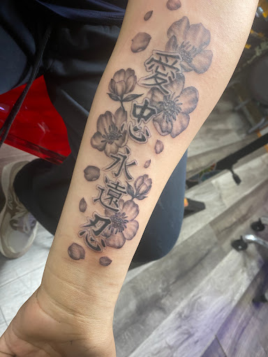 Explore hand mens tattoo ideas, creative tattoo ideas in Savannah, available at Tramp Art Studios