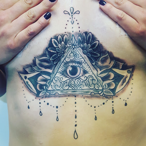 Explore spartan helmet tattoo ideas, creative tattoo ideas in Spencer, available at Ink Envy Tattoo And Body Piercing