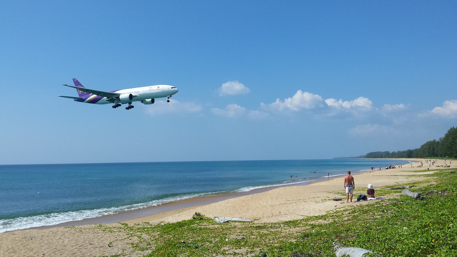 Foto de Naiyang Beach con arena beige superficie