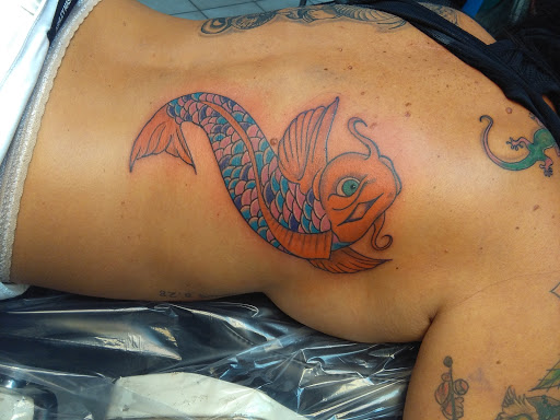 Explore womens shoulder tattoo ideas, creative tattoo ideas in Bradenton, available at Memory Lane Tattoo Co.