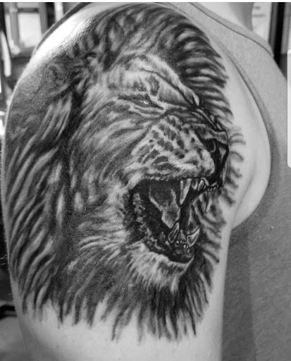 Explore cover up tattoo ideas female back, creative tattoo ideas in Erie, available at EliKingInk