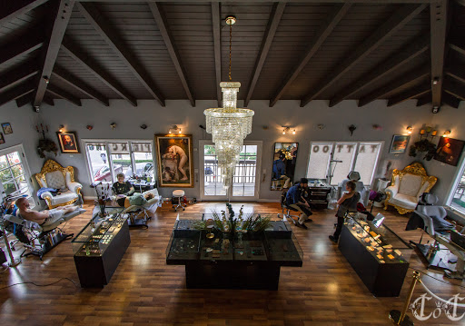 Explore weightlifting tattoo ideas, creative tattoo ideas in Laguna Beach, available at Cast of Crowns Art Collective