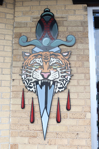 Explore spine tattoo ideas for men, creative tattoo ideas in Addison, available at Rising Phoenix Tattoo and Body Piercing