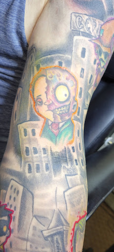 Explore dark sleeve tattoo ideas, creative tattoo ideas in Angola, available at Hoodlum Ink