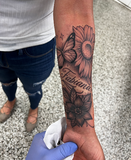 Explore black tattoo ideas for men, creative tattoo ideas in Sanford, available at Luv Ink