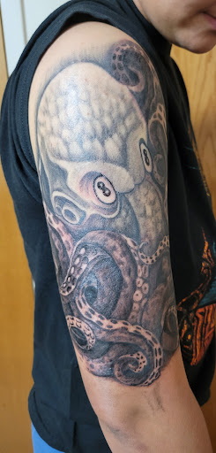 Explore tattoo ideas for womens thigh, creative tattoo ideas in Pensacola, available at Infinite Ink Tattoo Studio