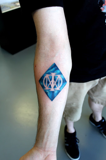 Explore mens wedding ring tattoo ideas, creative tattoo ideas in Fort Myers, available at Tiger Lotus Tattoo and Piercing