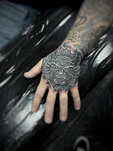 Explore hood neck tattoo ideas, creative tattoo ideas in Fort Myers, available at Loyal 2 The Coil Tattoos & Piercings (Edison Mall Location Entrance F)