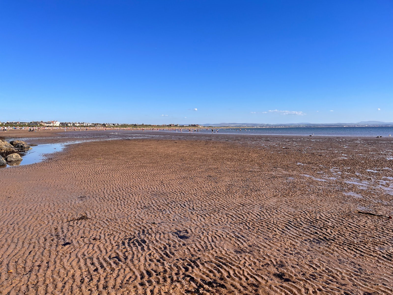Photo of Troon Beach with turquoise water surface