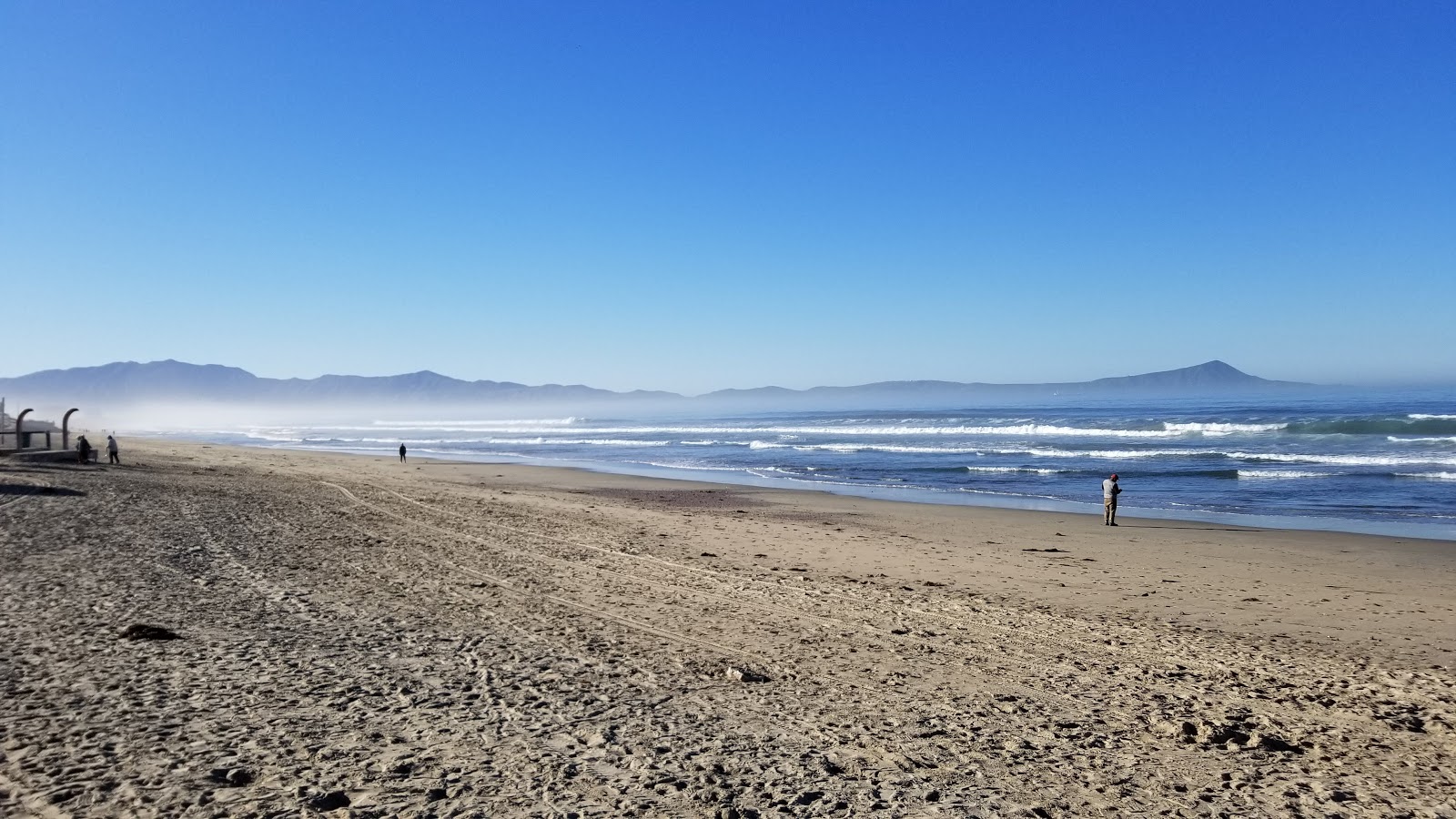 Foto av Playa Todos Santos med ljus sand yta