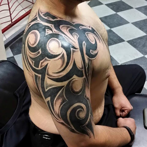 Explore tattoo of child's name ideas, creative tattoo ideas in Fort Mohave, available at RedRum Tattoo & Body Piercing Co.