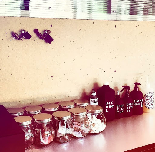 Explore female neck tattoo ideas, creative tattoo ideas in Carbondale, available at Bonedale Tattoo