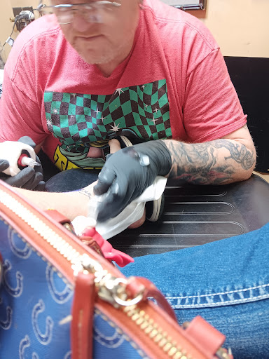 Explore cheek tattoo ideas, creative tattoo ideas in Brandon, available at Hot Box Tattoos