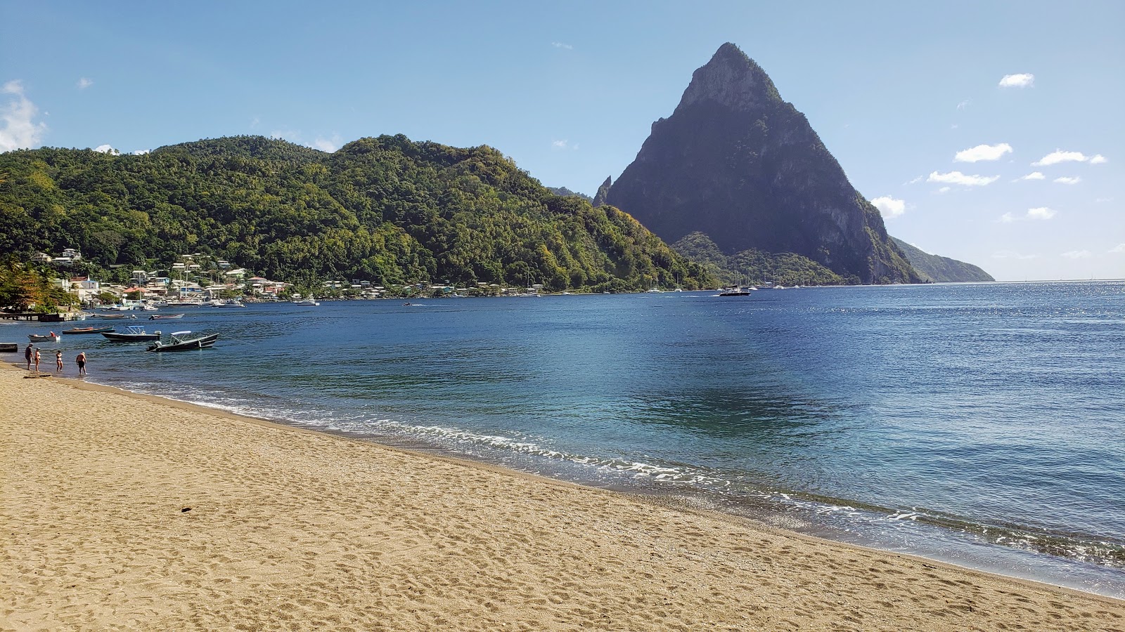 Photo of Soufriere beach with bright shell sand surface