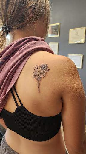 Explore tattoo ideas behind the ear, creative tattoo ideas in Fountain City, available at Innate Ink & Beauty