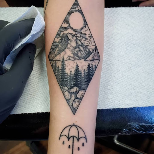 Explore cross tattoo cover up ideas, creative tattoo ideas in Reno, available at Evolution Tattoo