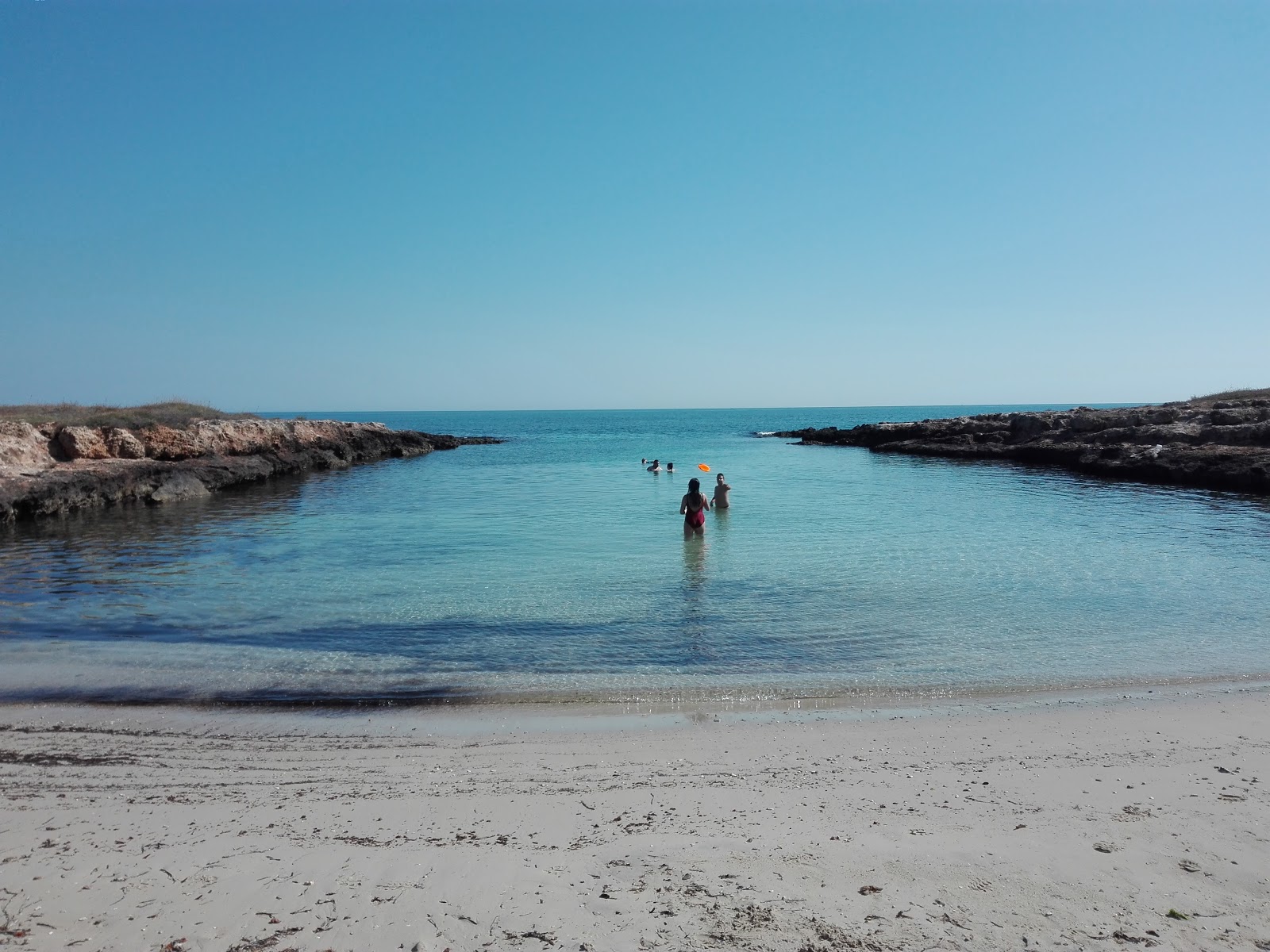Foto van Spiaggia di Gorgognolo met blauw puur water oppervlakte