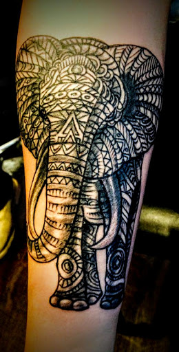 Explore rose tattoo ideas, creative tattoo ideas in Bridgeport, available at Pike Street Studios Tattoo and Body Piercing