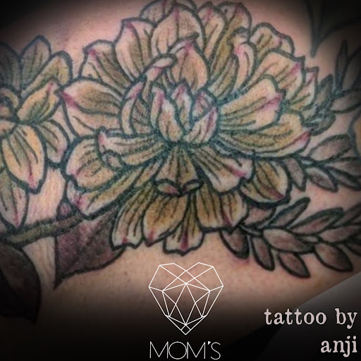 Explore back of neck tattoo cover up ideas, creative tattoo ideas in Spokane, available at Moms Custom Tattoo & Body Piercing