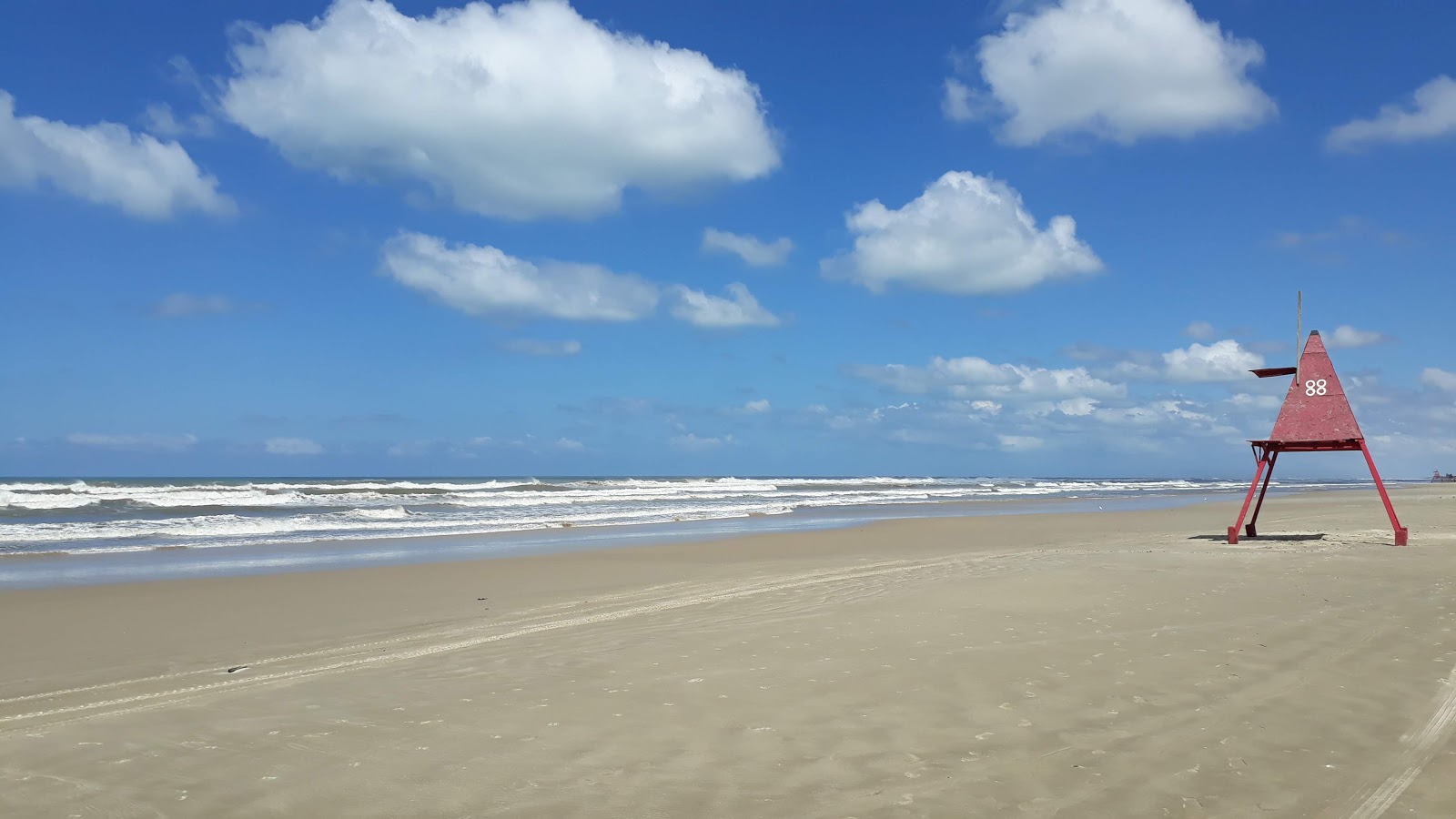 Foto de Praia de Xangri-la com alto nível de limpeza