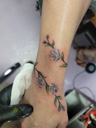 Find tattoo promo ideas for your next unique tattoo in Shawnee at The Mad Tatter