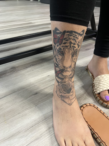 Explore blackout sleeve tattoo ideas, creative tattoo ideas in Ocala, available at The Black Sheep Tattoo Shop