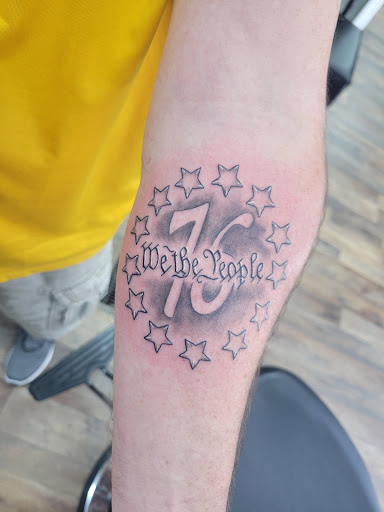 Explore matching tattoos for father and son ideas, creative tattoo ideas in Vincennes, available at Silver Owl Tattoo