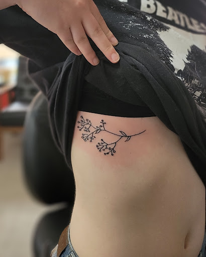 Explore behind the ear tattoo ideas, creative tattoo ideas in Lees Summit, available at The Cherry Bomb Tattoo Co.