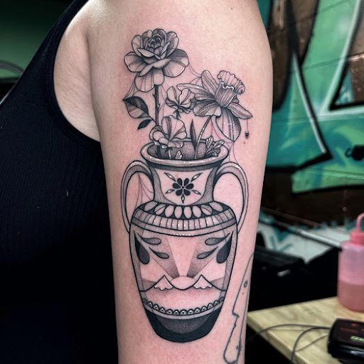 Explore grim reaper sleeve tattoo ideas, creative tattoo ideas in Cincinnati, available at UniquInk Tattoos & Piercings