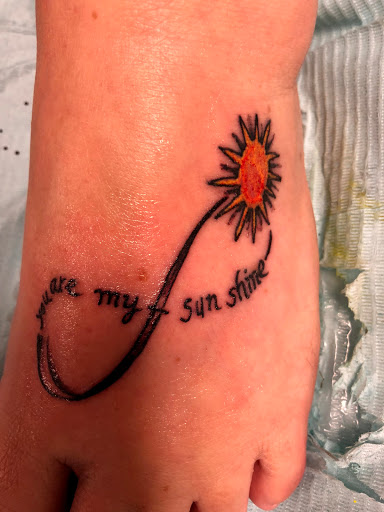 Explore locket tattoo ideas, creative tattoo ideas in Seymour, available at American Gypsy Tattoo Corp.