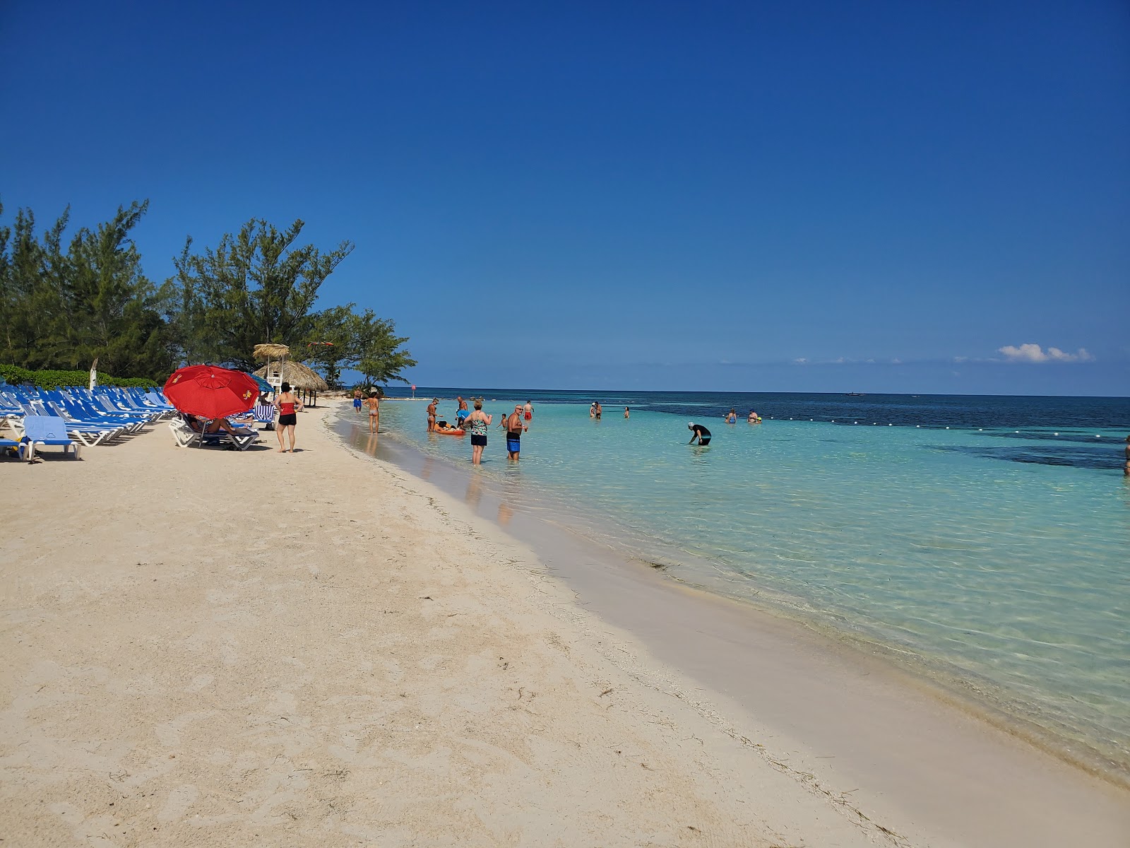 Photo of Blue Waters Beach with bright fine sand surface