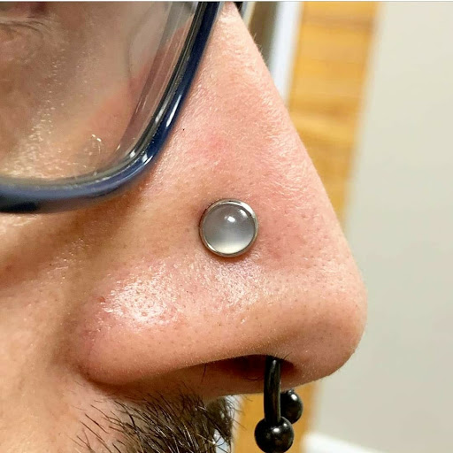 Explore gemini tattoo ideas for men, creative tattoo ideas in Summerville, available at Exotic Impressions Body Piercing