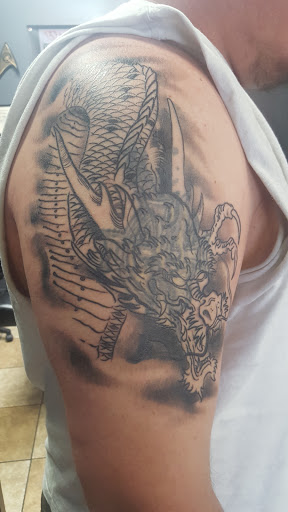 Explore tiger lily tattoo ideas, creative tattoo ideas in Saint Cloud, available at Dark Matter Tattoo