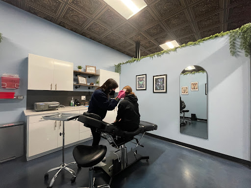 Explore half leg sleeve tattoo ideas, creative tattoo ideas in Minneapolis, available at Sacred Siren Tattoo & Art Parlor