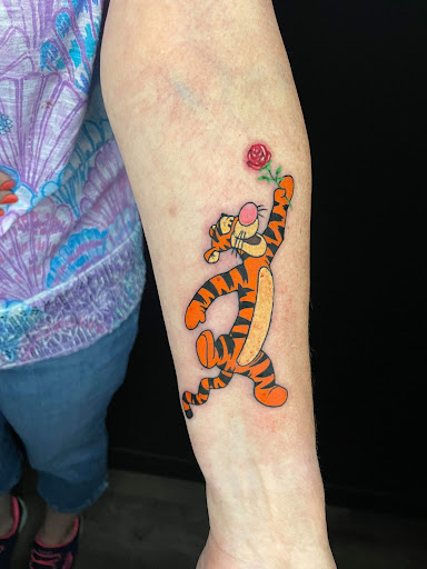 Explore spina bifida tattoo ideas, creative tattoo ideas in Edgewood, available at Legacy Tattoo And Art Gallery