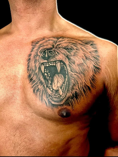 Explore tattoo thigh ideas, creative tattoo ideas in Warner Robins, available at Untold Pain Tattoo Studio