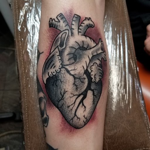 Explore front neck tattoo ideas, creative tattoo ideas in Lagrangeville, available at Black Cherry Tattoo Studio NY