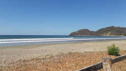 Foto di Spiaggia di Ostional sorretto da scogliere