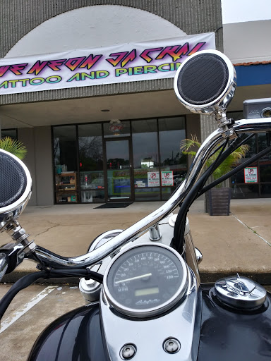 Explore dainty flower tattoo ideas, creative tattoo ideas in Houston, available at The Neon Jackal Tattoo