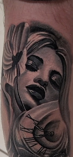 Explore arm tattoos ideas, creative tattoo ideas in Ocoee, available at Slaughterized Ink Tattoo and Piercing Studio