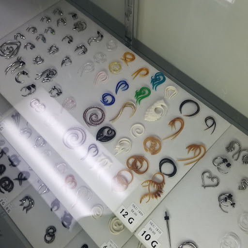 Explore mickey mouse tattoo ideas, creative tattoo ideas in Huntington Beach, available at Tommy Ts Body Piercing