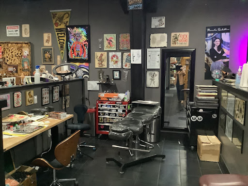 Explore coy fish tattoo ideas, creative tattoo ideas in Pensacola, available at Pensacola Tattoo Studio, Inc.