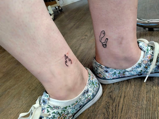 Explore women hand tattoo ideas, creative tattoo ideas in Lake City, available at Crooked Spines Tattoo Studio